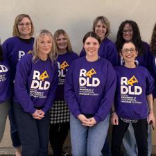 Group of women with DLD Awareness sweatshirts on.